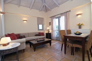 Superior Suite (for 2-4 people Afrodite, Artemis or Nafsika) | Living room | 40-inch LCD TV with digital channels, TV - Harmony Hotel Apartments (Aigialeia)