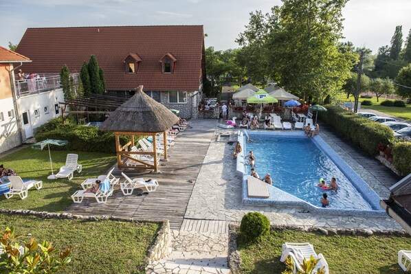 Seasonal outdoor pool, pool loungers