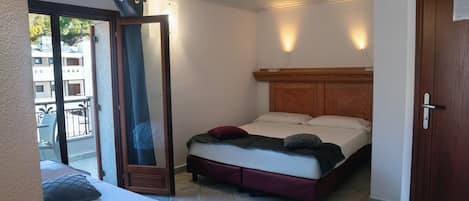 Comfort Triple Room | Minibar, in-room safe, blackout drapes, iron/ironing board (on request)