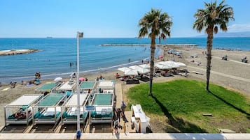 On the beach, sun loungers, beach umbrellas