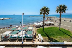 On the beach, sun loungers, beach umbrellas