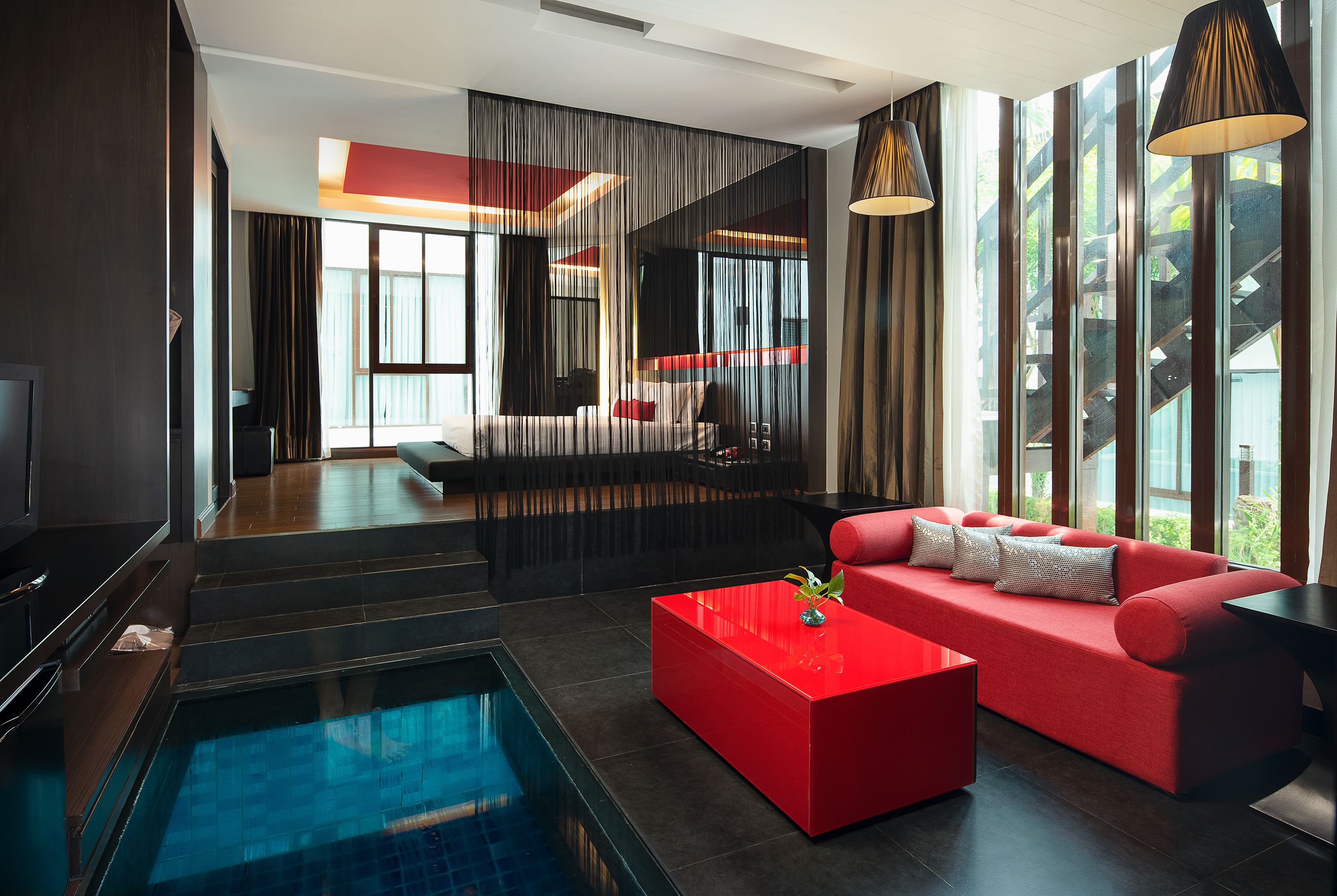 deluxe king room pool view  | living area | led tv