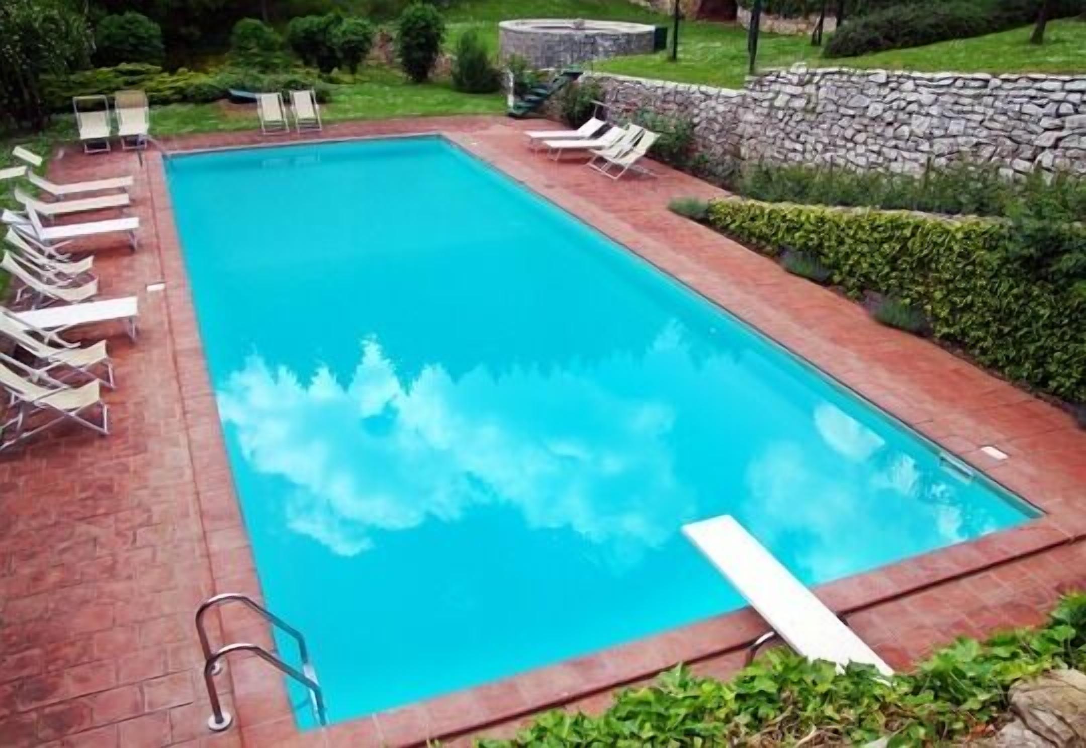 Seasonal outdoor pool, pool umbrellas, pool loungers