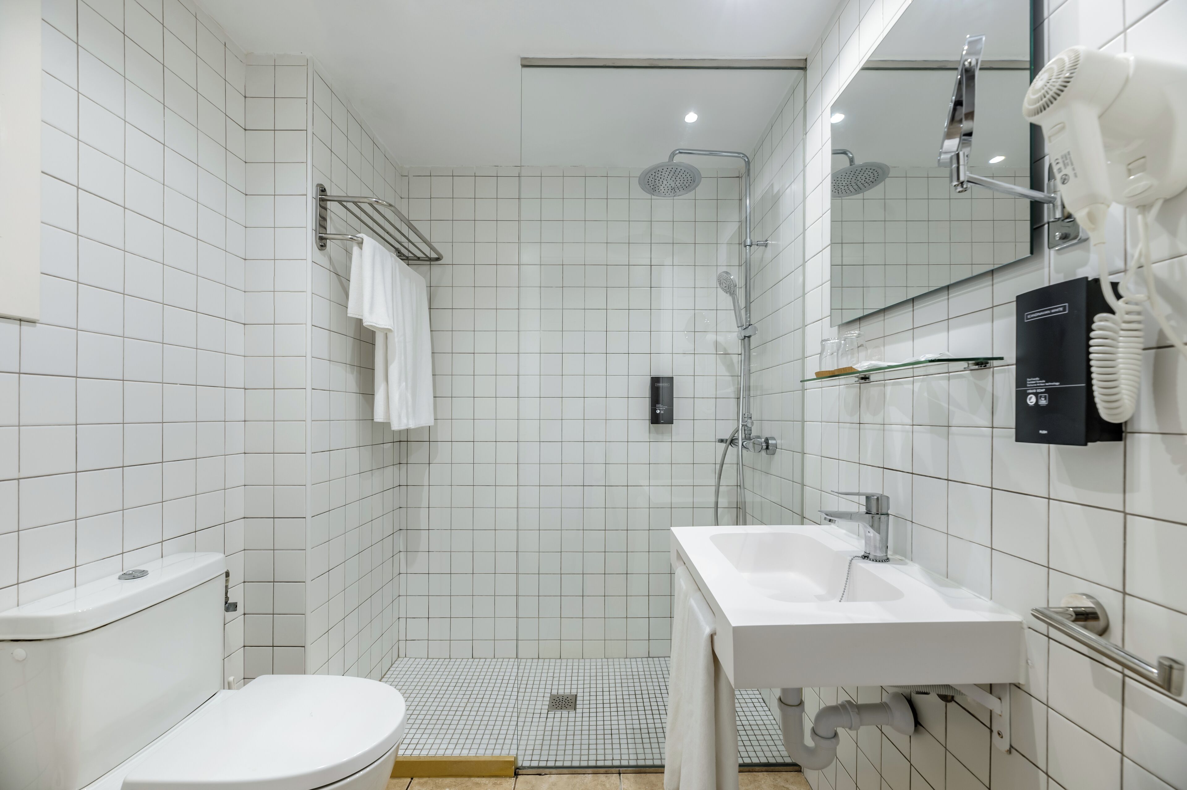 shower, hair dryer, towels, soap