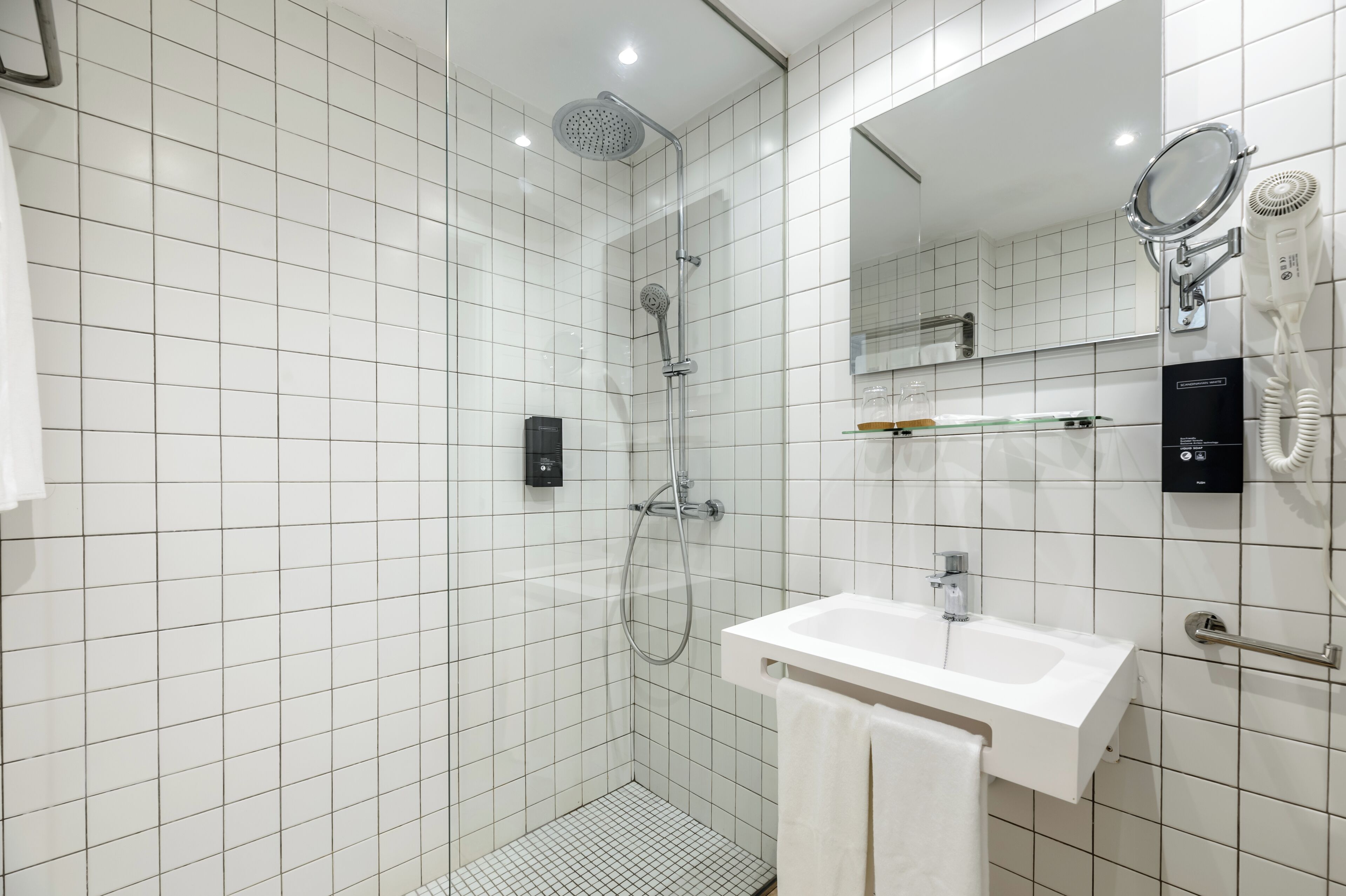 deluxe twin room | bathroom | shower, hair dryer, towels, soap