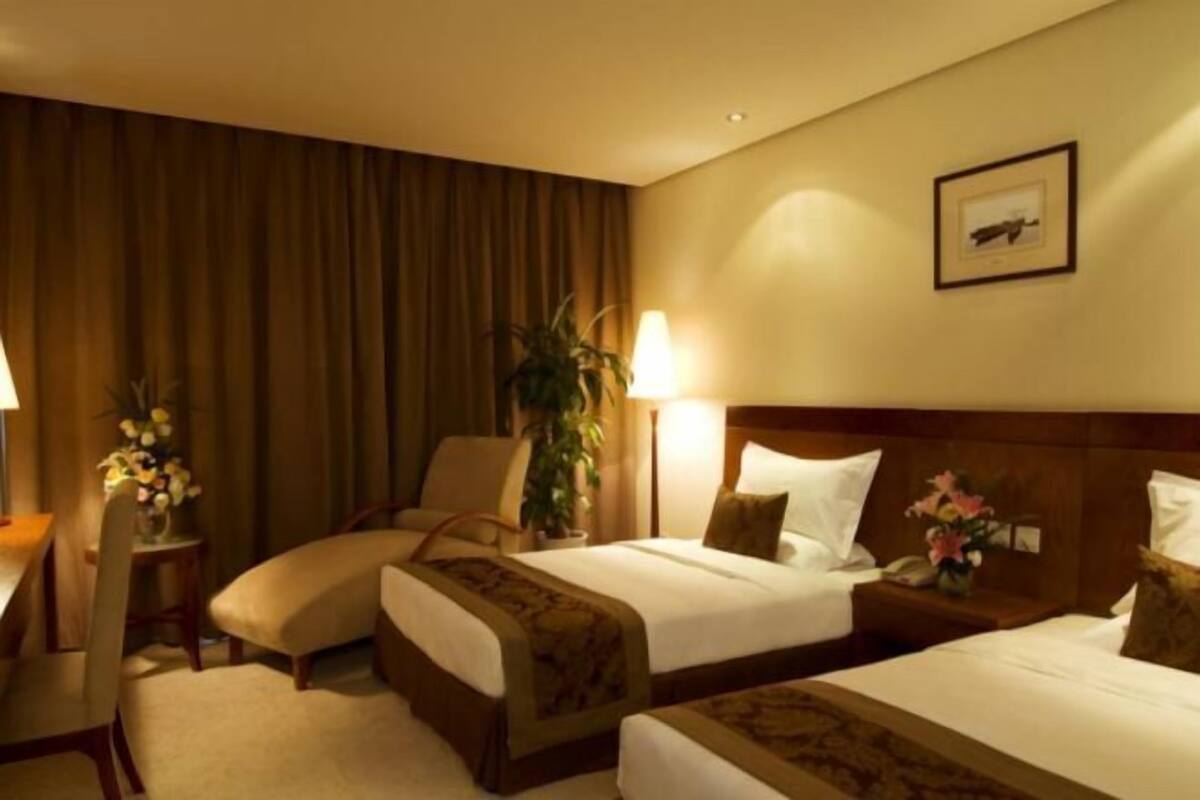 Luxe beddengoed, donzen dekbedden, een minibar, een kluis op de kamer