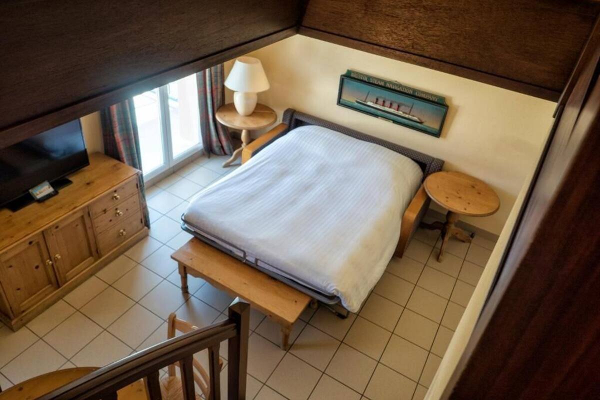 Premium bedding, down comforters, laptop workspace, blackout drapes