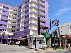 A multi-story building with a purple facade, a taxi stand, and a sign for Pattaya Central. - Sawasdee Siam, Pattaya (Pattaya)