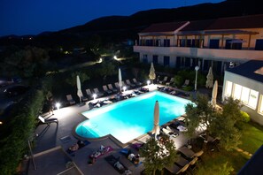 Indoor pool, seasonal outdoor pool, pool umbrellas, pool loungers