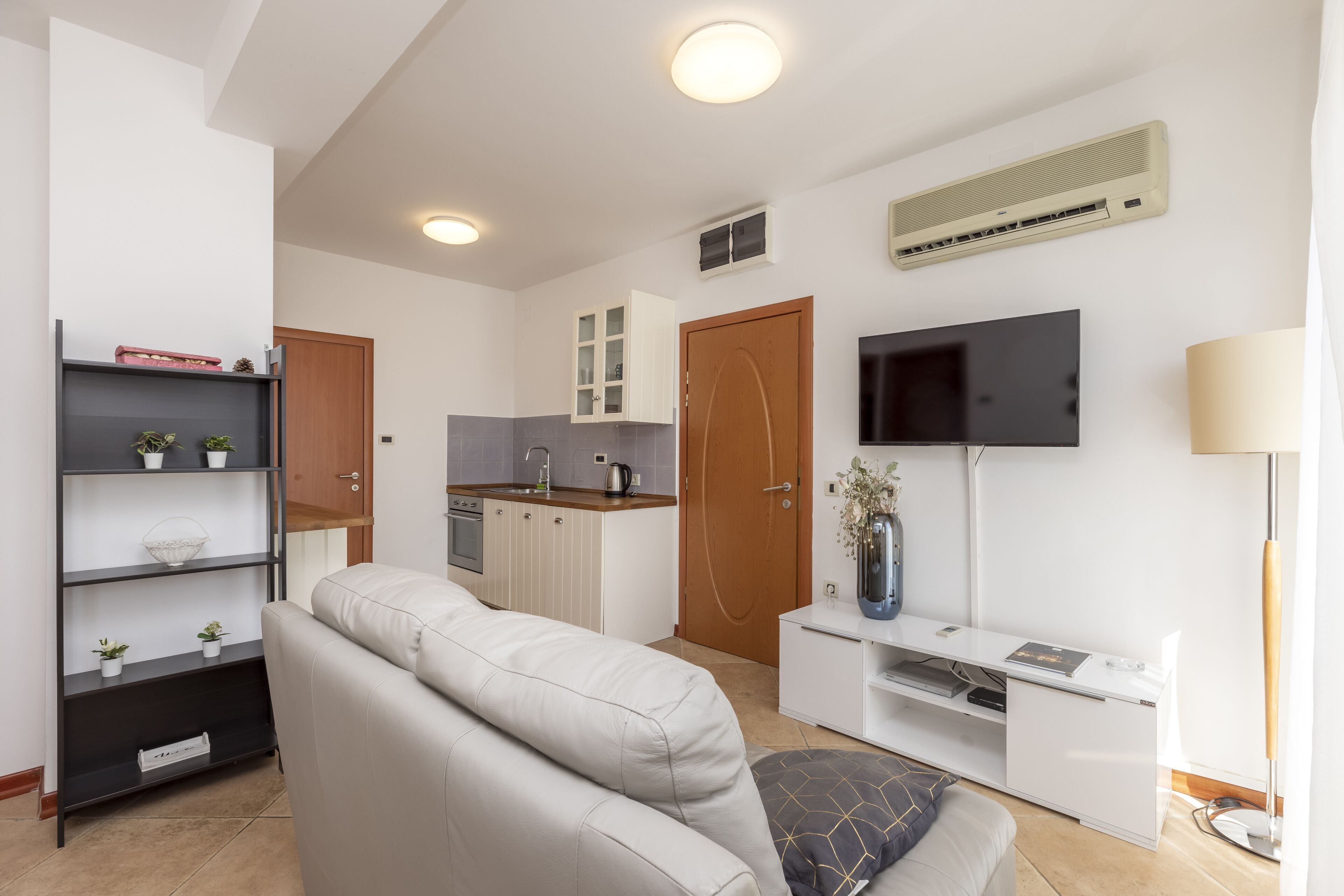 family apartment | living room | 70-cm lcd tv with satellite channels, tv, toys