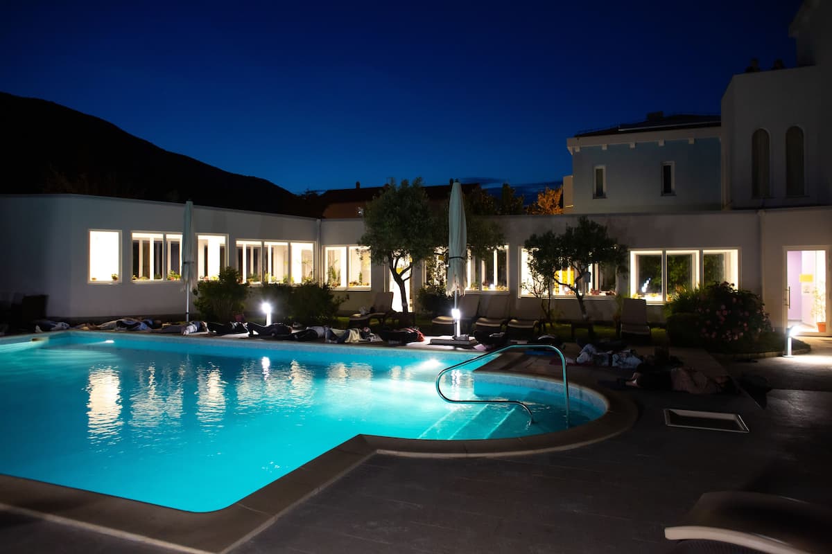 indoor pool, seasonal outdoor pool, pool umbrellas, pool loungers