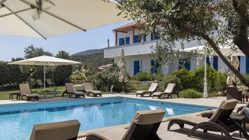 Indoor pool, seasonal outdoor pool, pool umbrellas, pool loungers