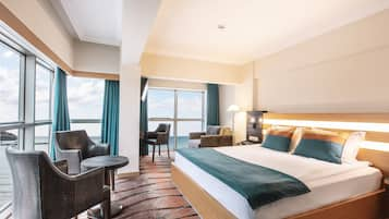 Deluxe Room, Sea View | Minibar, in-room safe, desk, iron/ironing board