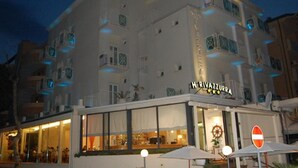 A multi-story hotel with balconies and a sign reading "H. RIVAZZURRA". - Hotel Rivazzurra (Pesaro)