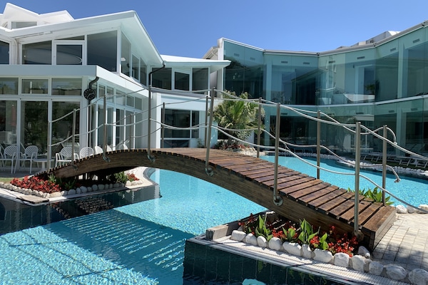 Indoor pool, 2 outdoor pools, open 8:00 AM to 11:30 PM, pool umbrellas