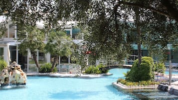 Indoor pool, pool umbrellas, pool loungers