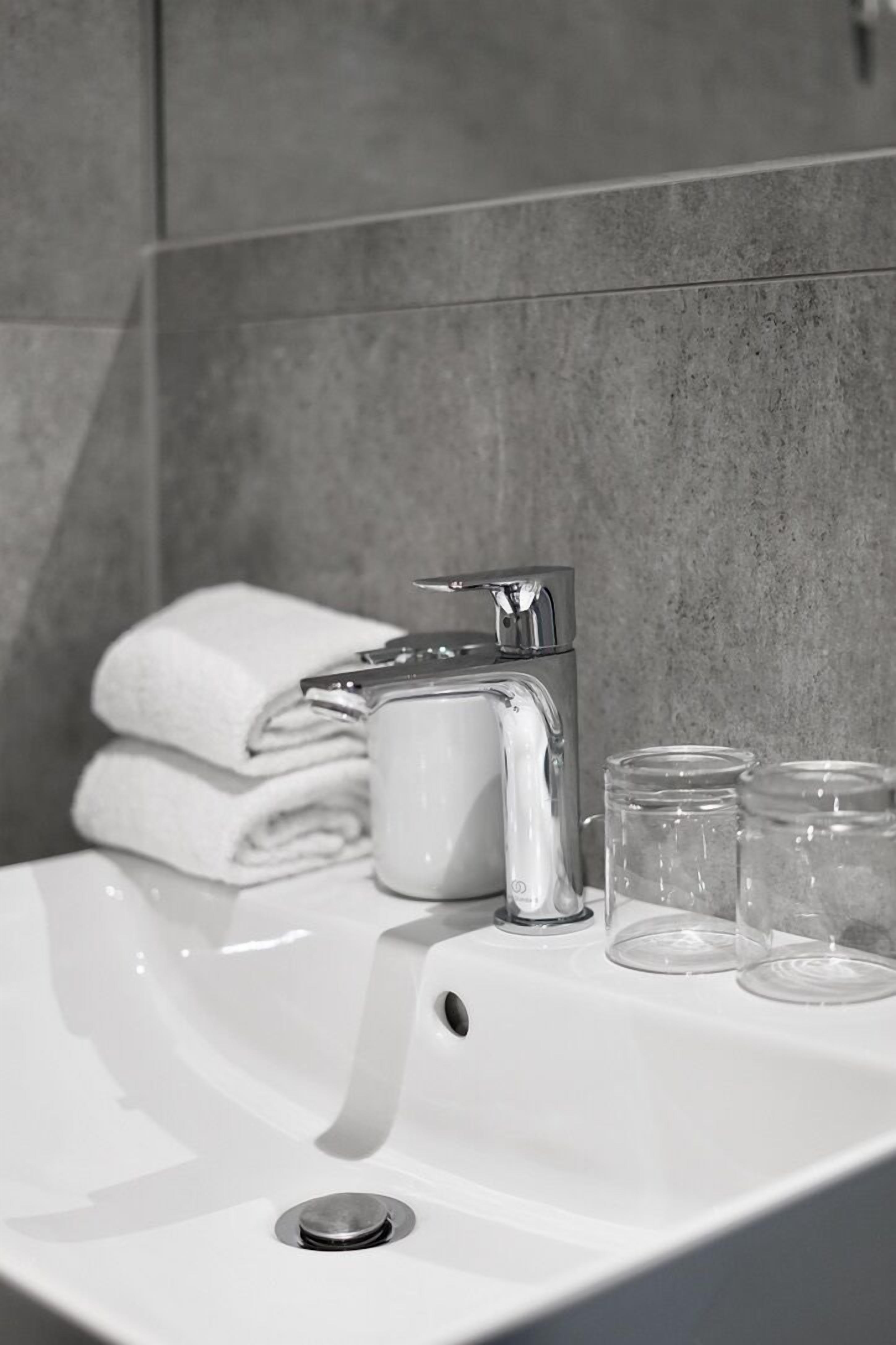 hair dryer, towels, soap, shampoo