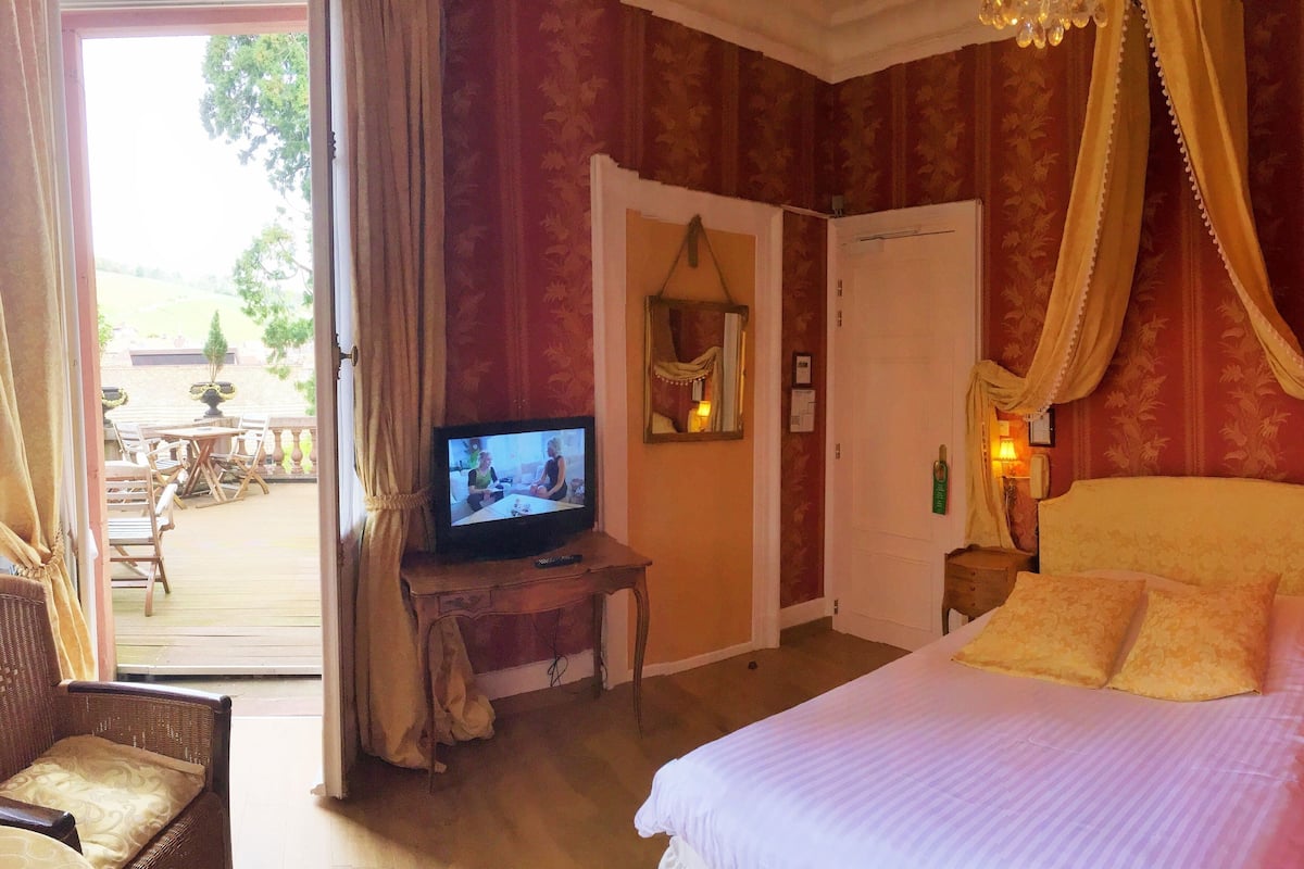 Premium bedding, desk, laptop workspace, soundproofing