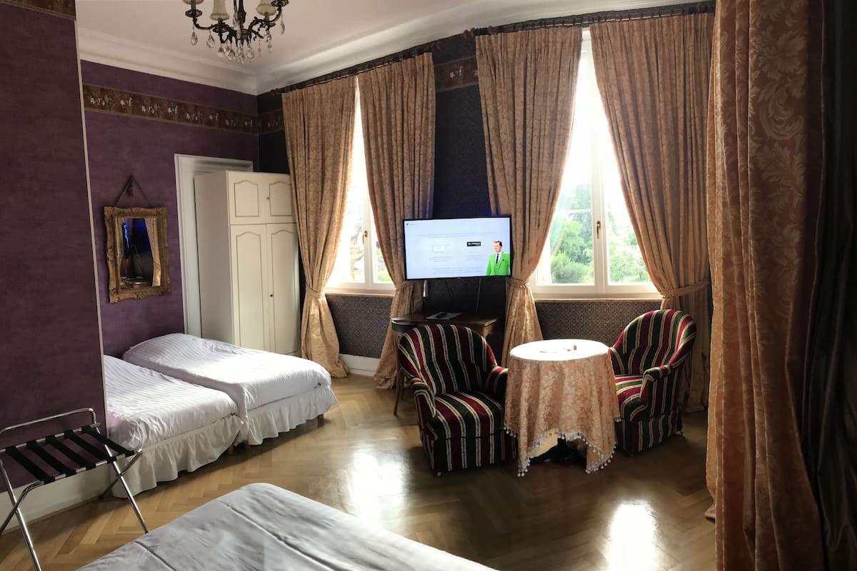 Premium bedding, desk, laptop workspace, soundproofing