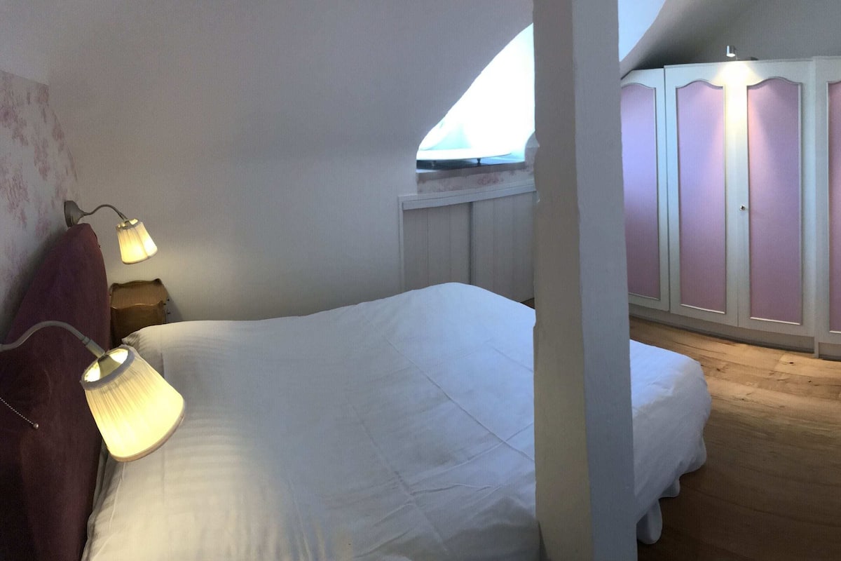 Premium bedding, desk, laptop workspace, soundproofing