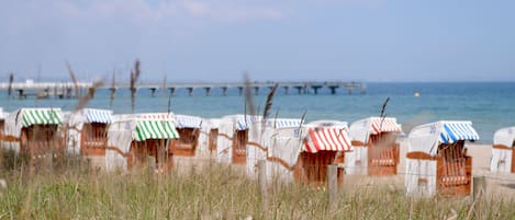 On the beach, sun loungers, beach umbrellas, beach towels