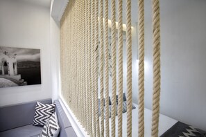Superior Double Room (Deluxe) | Living area | 42-inch LED TV with satellite channels, TV - Privee Santorini (Santorini)