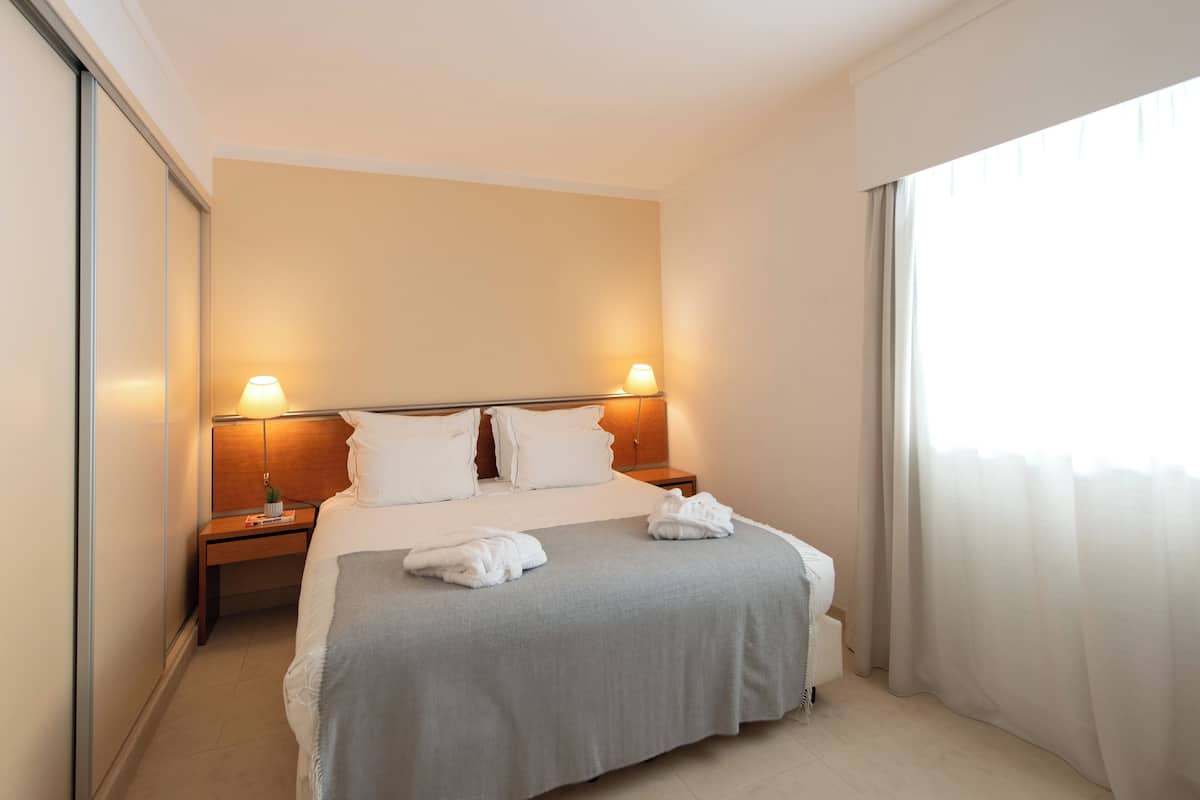 Premium bedding, memory foam beds, in-room safe, desk
