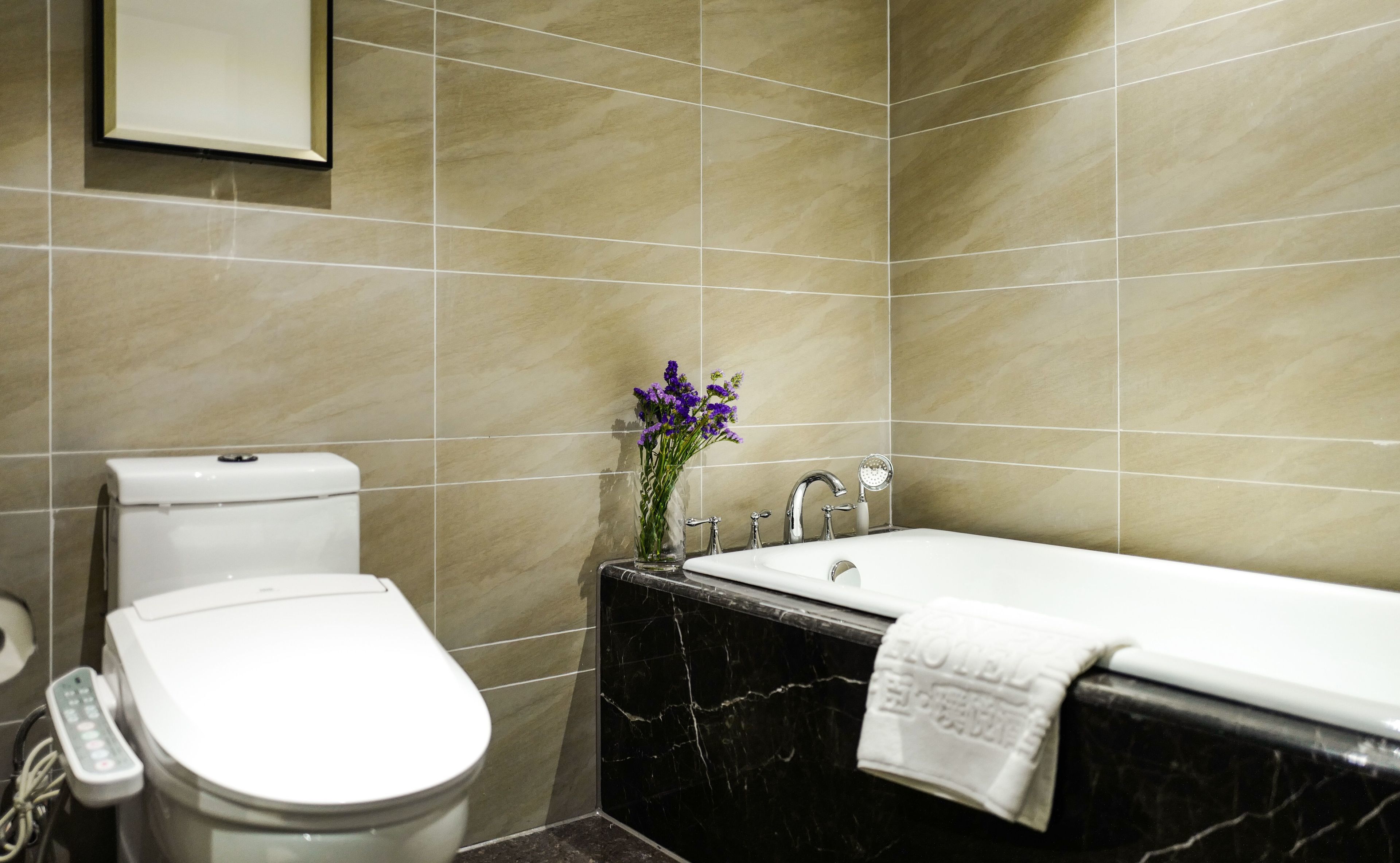 luxury room, 1 king bed | bathroom | free toiletries, hair dryer, slippers, towels