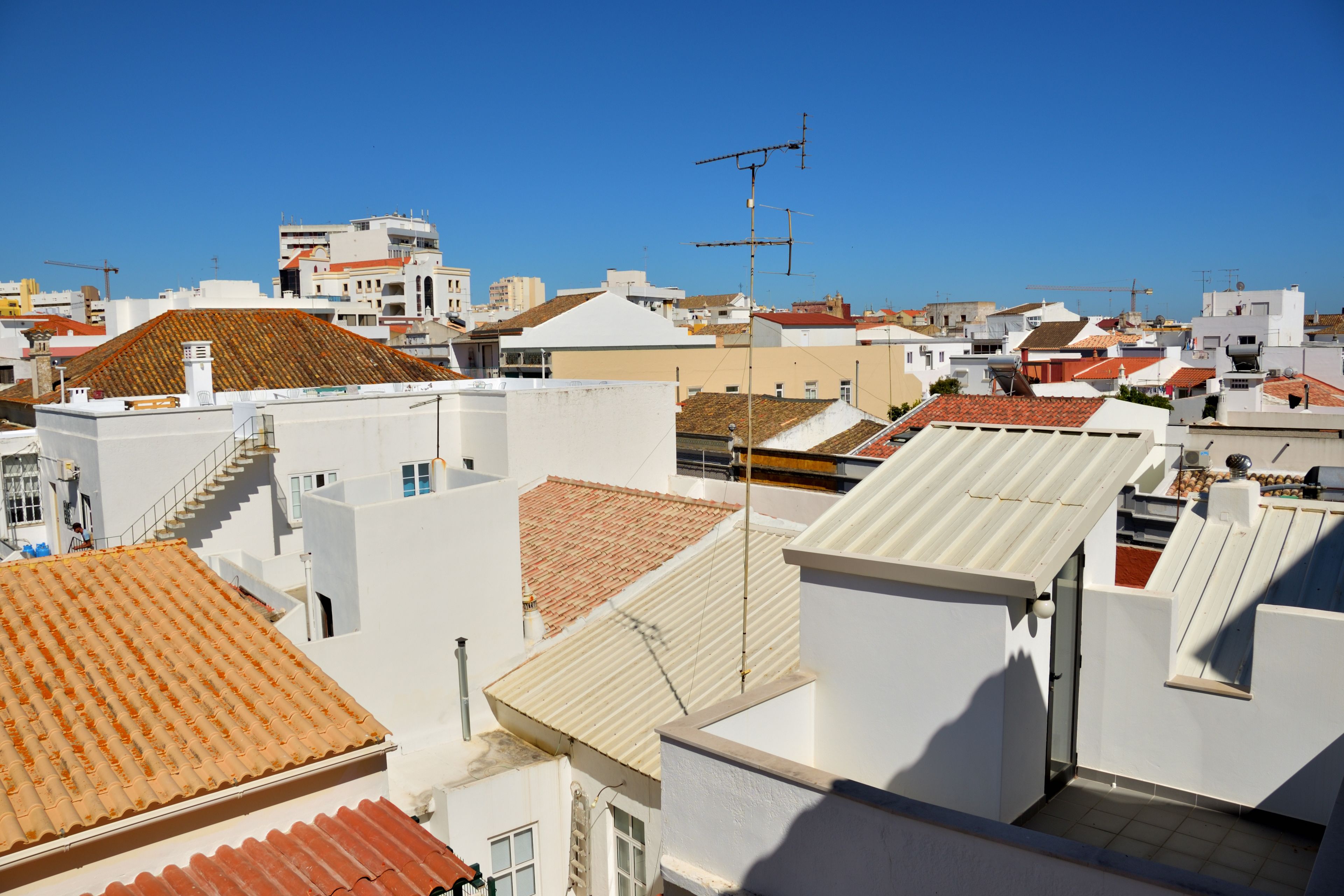 A densely packed urban area with various buildings, including residential and commercial structures.