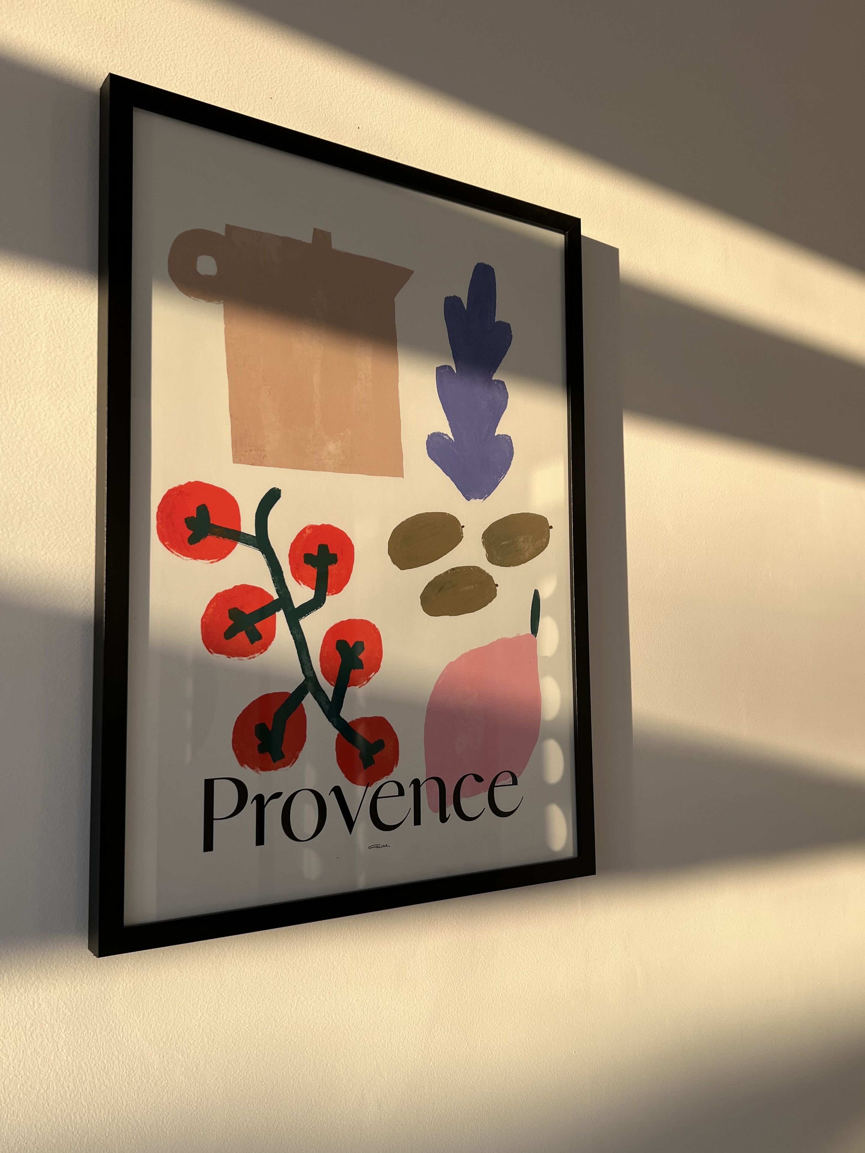 Ein gerahmtes Kunstwerk mit abstrakten Formen und dem Wort "Provence" unten.
