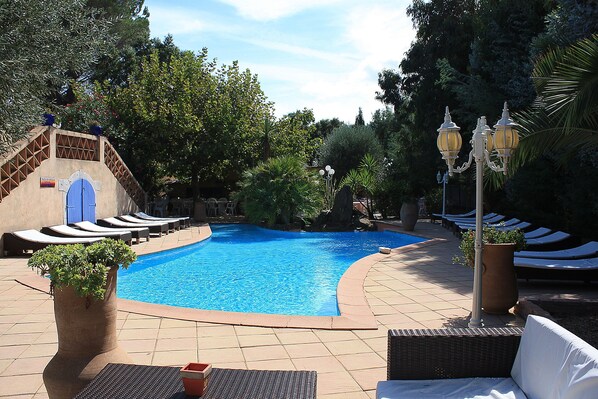 Seasonal outdoor pool, pool loungers