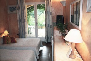 Double Room, Pool View, Ground Floor (07) | Minibar, in-room safe, desk, blackout curtains - Athénopolis (Grimaud)