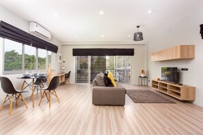 One Bedroom Balcony Apartment | Living area | Flat-screen TV