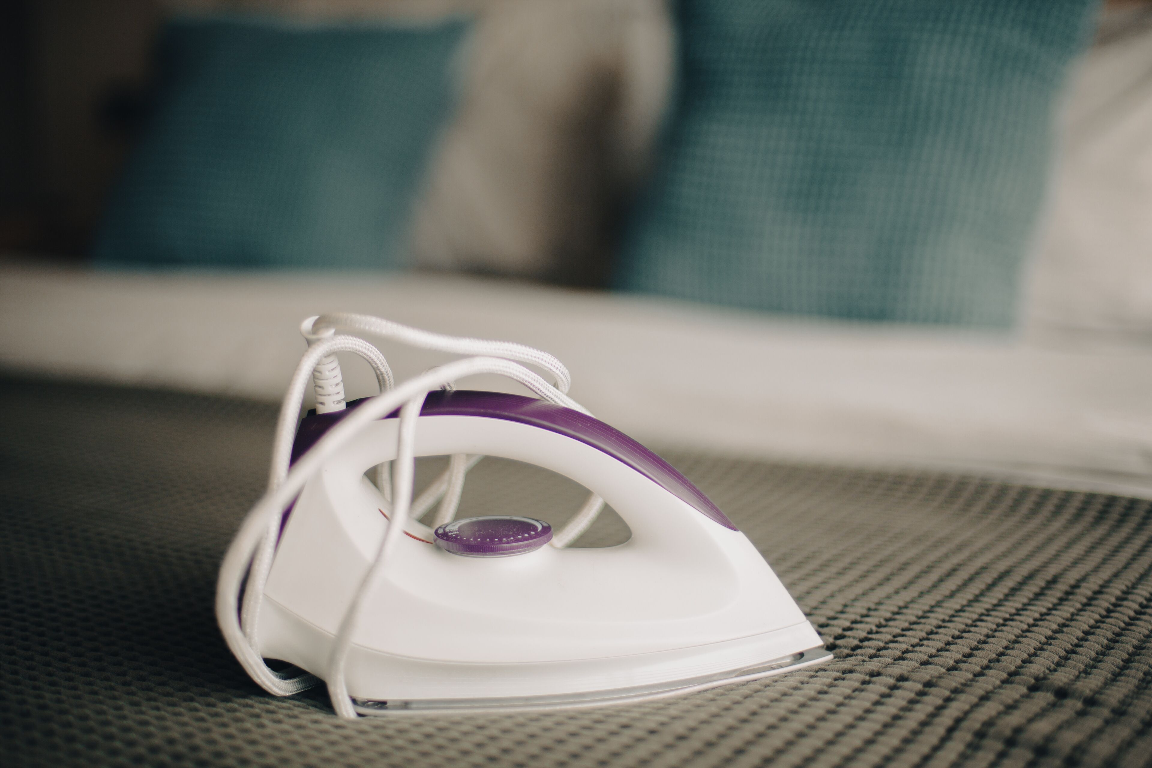 An iron on a textured surface.