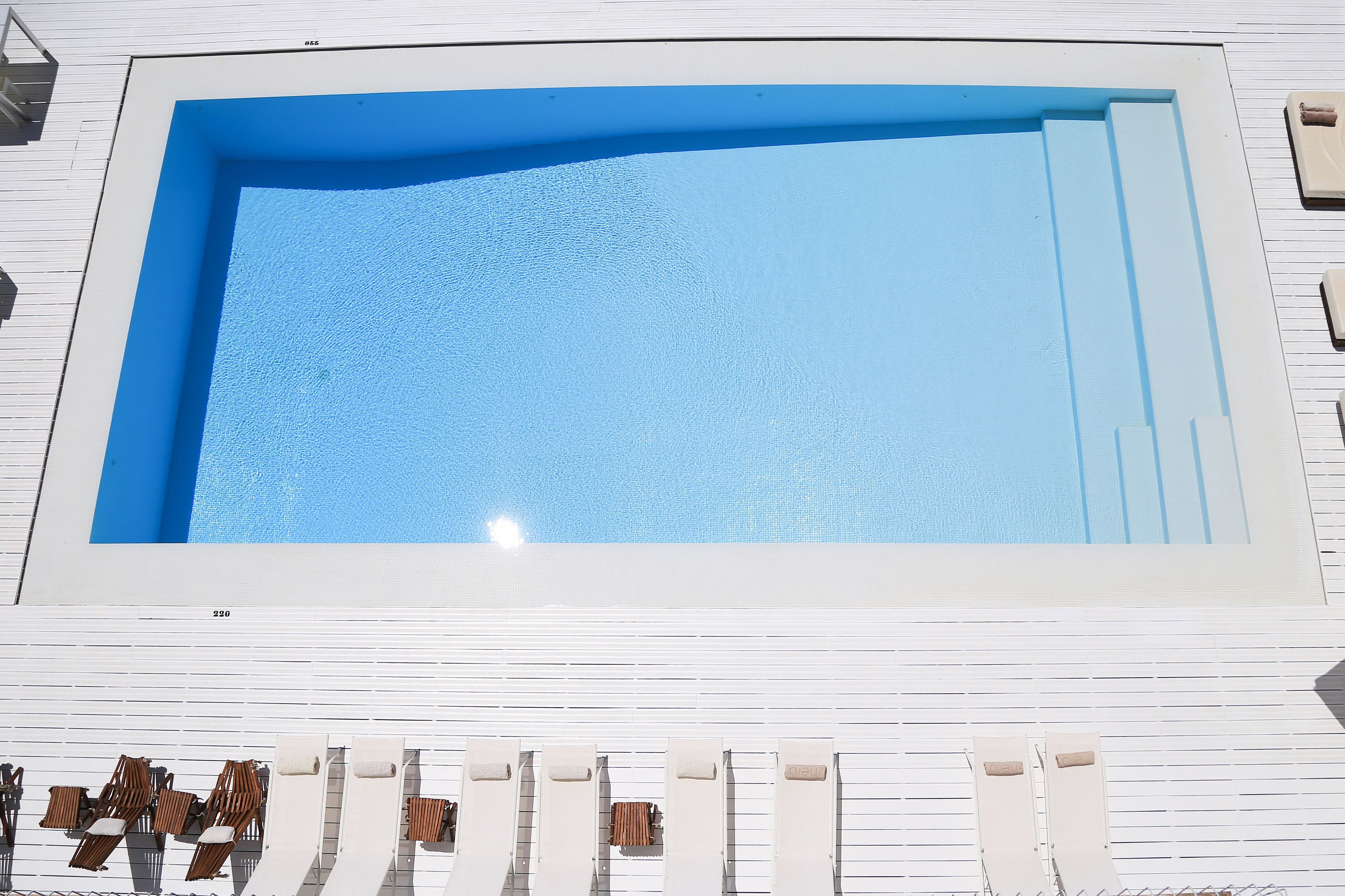 seasonal outdoor pool, pool umbrellas, pool loungers