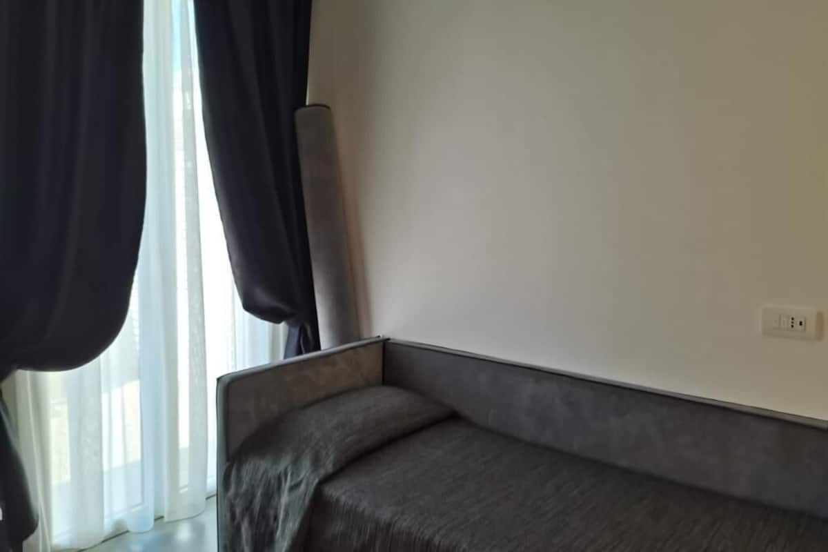 Superior Single Room, Partial Sea View | 1 bedroom, minibar, in-room safe, individually decorated