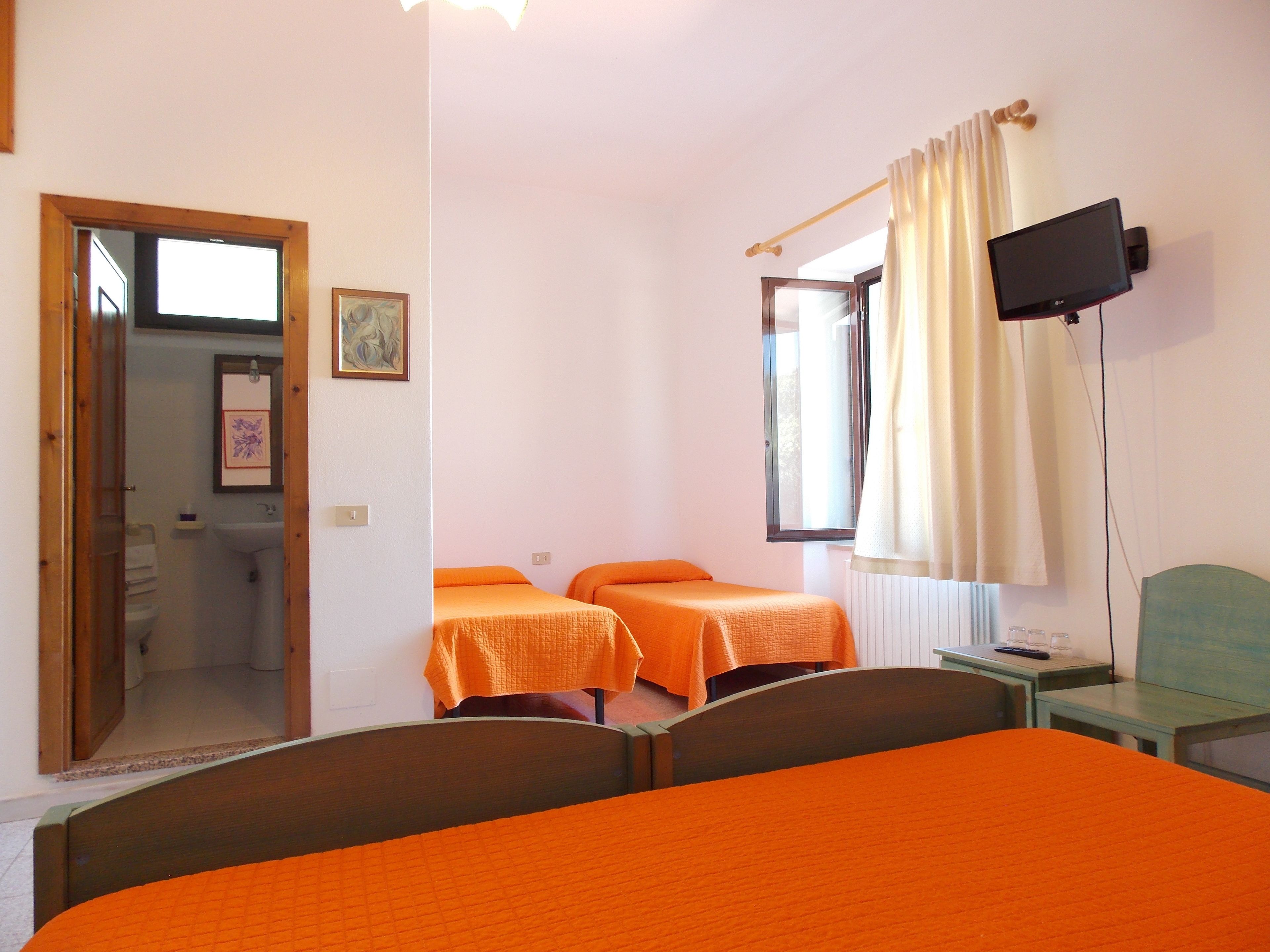 Basic Quadruple Room | Down comforters, iron/ironing board, free WiFi, bed sheets