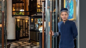 A hotel lobby with a checkered floor, a reception desk, and a large painting on the wall. - Aira Boutique Hanoi Hotel & Spa (Hanoi)