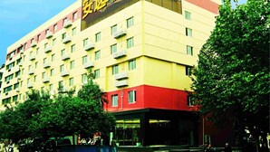 A multi-story hotel with a prominent sign on the top. - Ane Hotel - Eying Branch (Chengdu)
