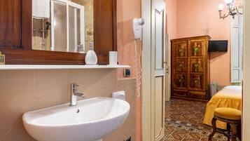 Shower, free toiletries, hair dryer, slippers
