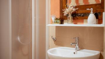 Shower, free toiletries, hair dryer, slippers