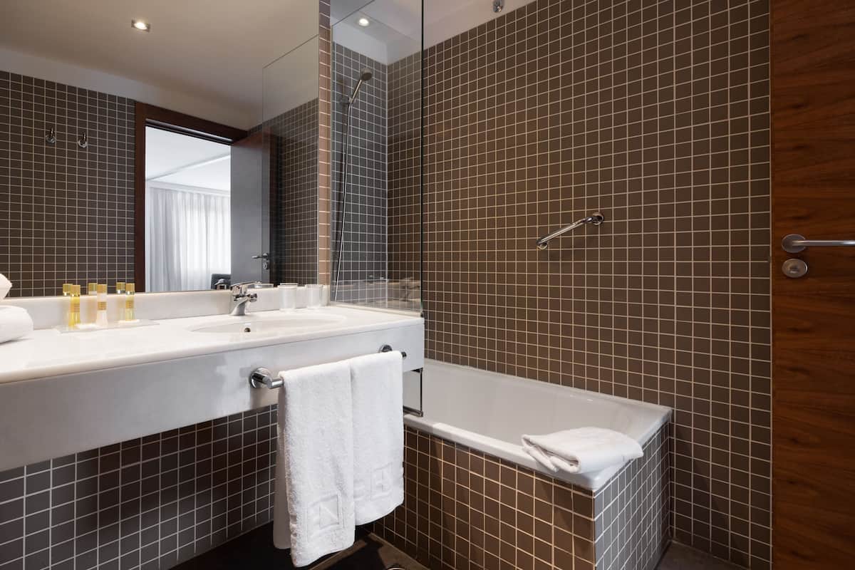 deluxe double room | bathroom | eco-friendly toiletries, hair dryer, towels