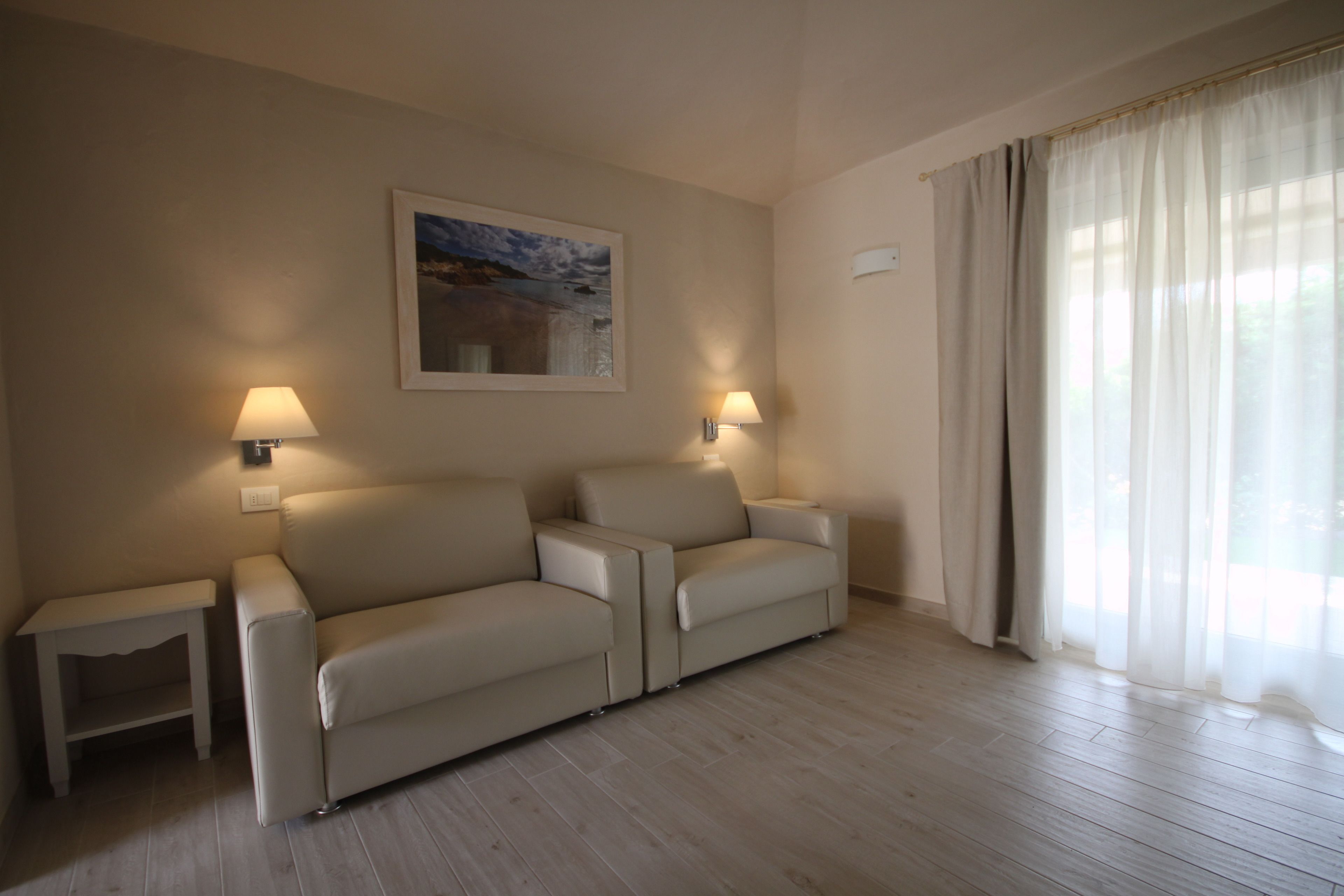 junior suite, terrace | living area | flat-screen tv