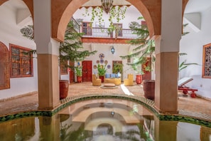 Indoor pool, open 10:00 AM to 10:00 PM, pool loungers