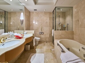 Combined shower/tub, free toiletries, hair dryer, slippers