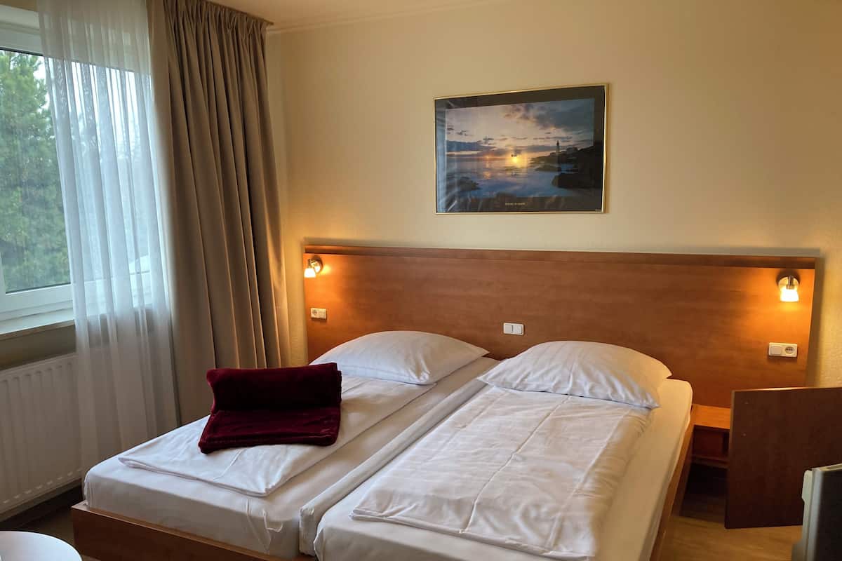Economy Double Room | Desk, blackout curtains, iron/ironing board (on request), free WiFi