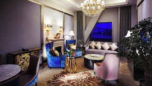 A luxurious living room with a chandelier, sofas, a coffee table, and a fireplace. - Intercontinental Resort Lhasa Paradise by IHG (Lhasa)