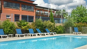 Seasonal outdoor pool, pool loungers