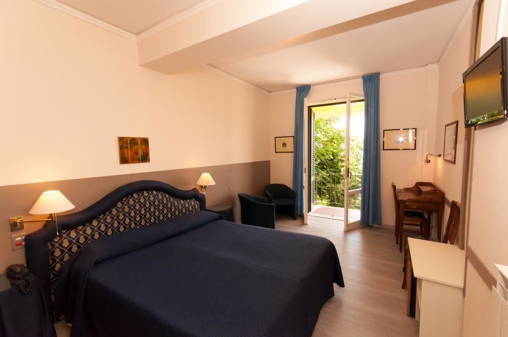 deluxe double room, balcony, garden view | minibar, in-room safe, desk, soundproofing