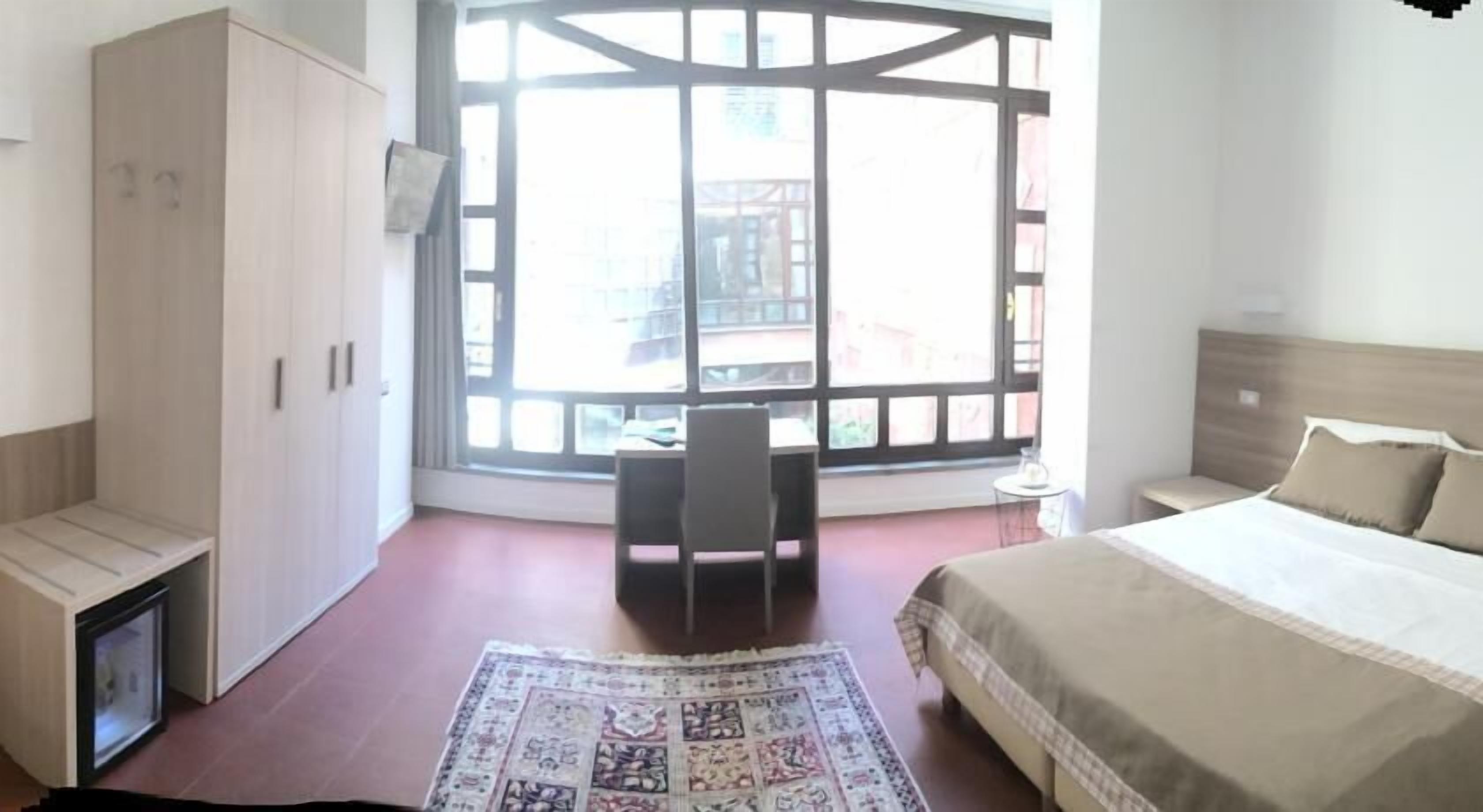 double room | minibar, in-room safe, blackout curtains, iron/ironing board